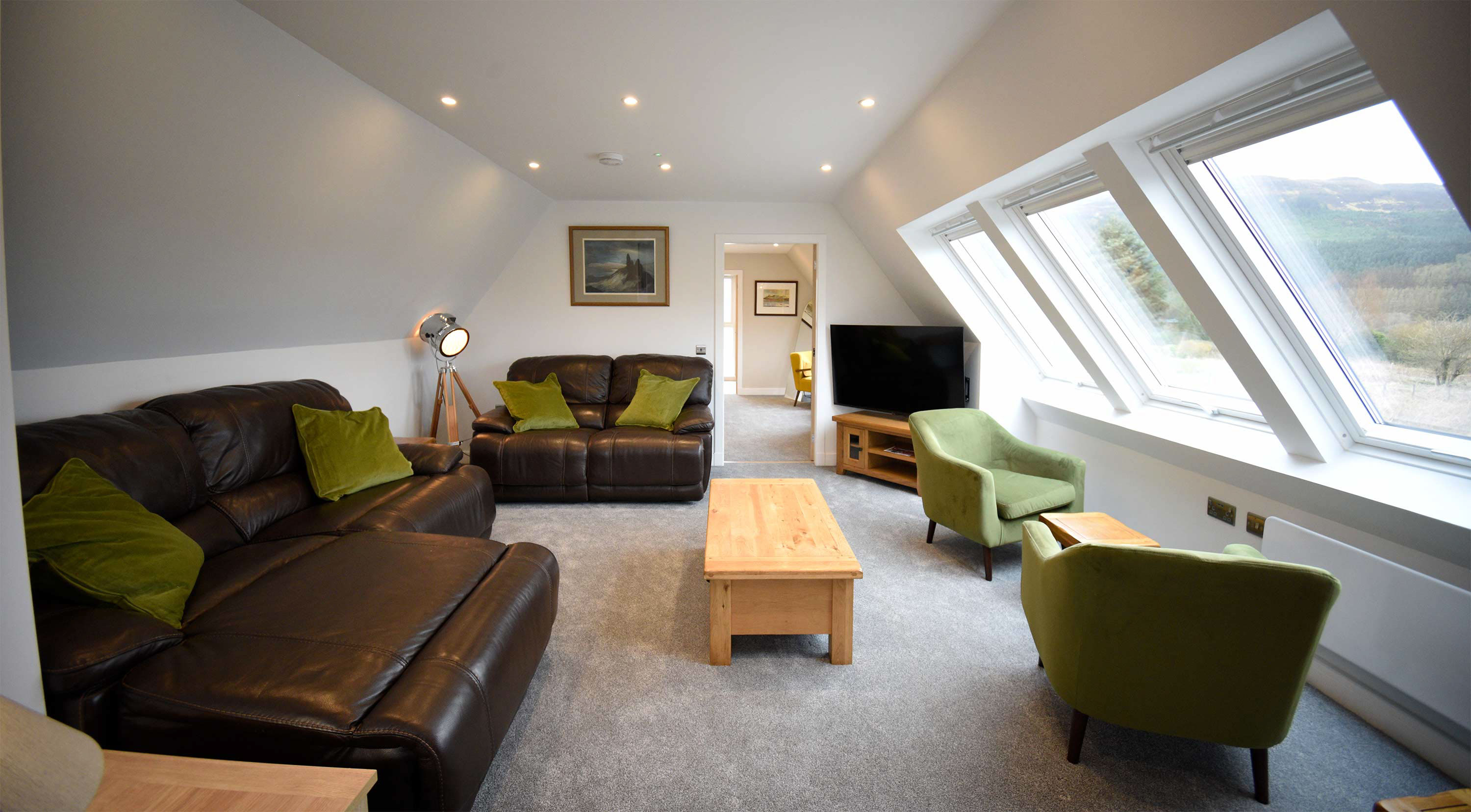 The Old Workshop open plan self catering accommodation near Portree looks on to sea and mountain views from the living room