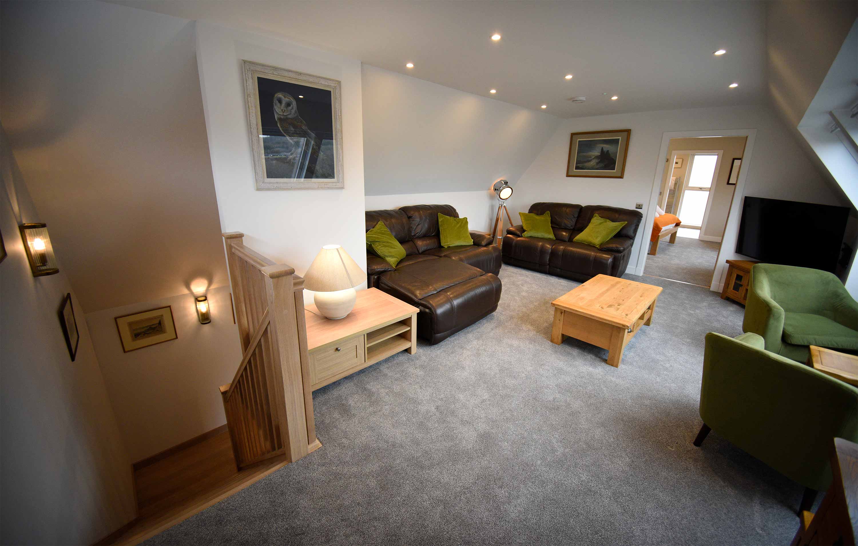 The Old Workshop self catering accommodation near Portree contains a spacious open plan living room with sea and mountain views